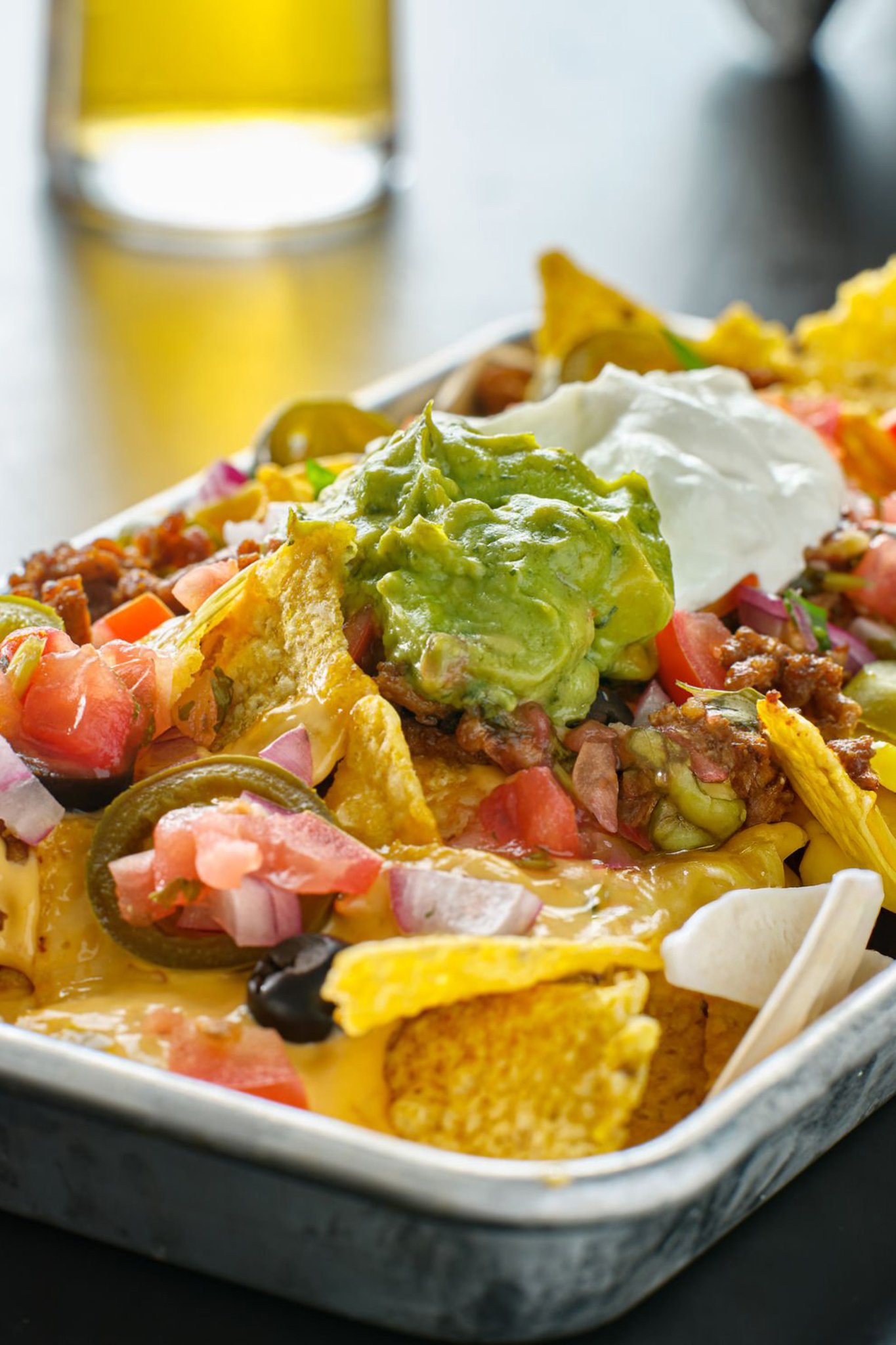 Elote on a stick with cheese, lime, and chili